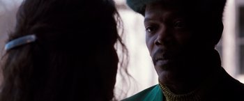Movie still from “The Long Kiss Goodnight” (1996), directed by Renny Harlin – A person wearing a green shirt; Close Up shot, Over the shoulder angle