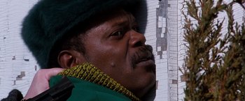 Movie still from “The Long Kiss Goodnight” (1996), directed by Renny Harlin – A person wearing a hat; Close Up shot, Overhead angle