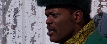 Movie still from “The Long Kiss Goodnight” (1996), directed by Renny Harlin – A person wearing a hat; Close Up shot, Low angle