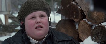 Movie still from “The Long Kiss Goodnight” (1996), directed by Renny Harlin – A young boy wearing a hat and a leather jacket; Close Up shot, Low angle