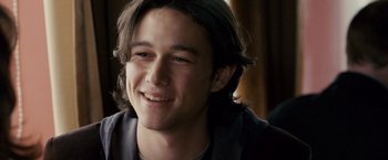 Movie still from “The Lookout” (2007), directed by Scott Frank – A person with long brown hair smiling; Close Up shot, Over the shoulder angle