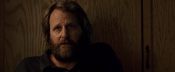 Movie still from “The Lookout” (2007), directed by Scott Frank – A person with long hair and a beard; Close Up shot, Over the shoulder angle