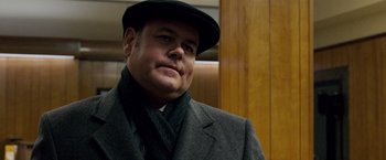 Movie still from “The Lookout” (2007), directed by Scott Frank – A man wearing a hat and a suit; Close Up shot, Low angle