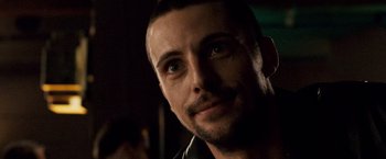 Movie still from “The Lookout” (2007), directed by Scott Frank – A person with a beard looking at the camera; Close Up shot, Over the shoulder angle