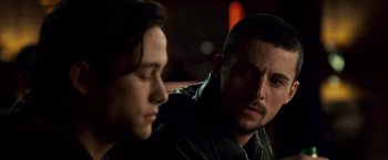 Movie still from “The Lookout” (2007), directed by Scott Frank – A man sitting next to a woman in a dark room; Close Up shot, Over the shoulder angle