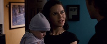 Movie still from “The Lookout” (2007), directed by Scott Frank – A woman holding a baby in her arms; Close Up shot, Over the shoulder angle
