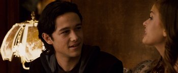 Movie still from “The Lookout” (2007), directed by Scott Frank – A young man sitting in front of a wooden wall; Close Up shot, Over the shoulder angle
