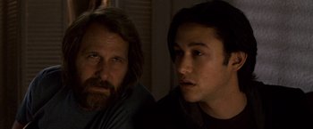 Movie still from “The Lookout” (2007), directed by Scott Frank – Two men sitting next to each other in the dark; Close Up shot, Over the shoulder angle