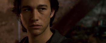 Movie still from “The Lookout” (2007), directed by Scott Frank – A young man's face with a dark background; Close Up shot, Over the shoulder angle