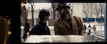 Movie still from “The Lookout” (2007), directed by Scott Frank – A man and a young boy talking to each other; Medium shot, Over the shoulder angle