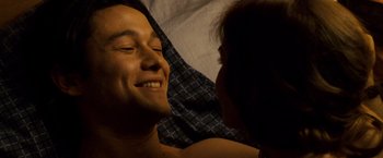 Movie still from “The Lookout” (2007), directed by Scott Frank – A man and a woman laying in a bed together; Close Up shot, Overhead angle