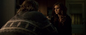 Movie still from “The Lookout” (2007), directed by Scott Frank – Two people are sitting in a dark room; Medium shot, Over the shoulder angle