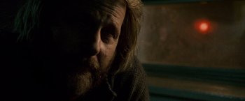 Movie still from “The Lookout” (2007), directed by Scott Frank – A person with long hair and a beard; Close Up shot, Over the shoulder angle