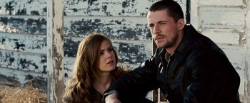 Movie still from “The Lookout” (2007), directed by Scott Frank – A man and a woman standing next to each other; Close Up shot, Over the shoulder angle