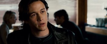 Movie still from “The Lookout” (2007), directed by Scott Frank – A man in a leather jacket looking at the camera; Close Up shot, Over the shoulder angle