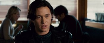 Movie still from “The Lookout” (2007), directed by Scott Frank – A man in a leather jacket looking at the camera; Close Up shot, Over the shoulder angle