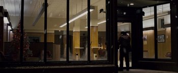 Movie still from “The Lookout” (2007), directed by Scott Frank – A person standing in front of an open window; Wide shot, Low angle