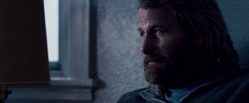 Movie still from “The Lookout” (2007), directed by Scott Frank – A person with a beard; Close Up shot, Over the shoulder angle