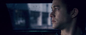 Movie still from “The Lookout” (2007), directed by Scott Frank – A person in a car looking out the window; Close Up shot, Over the shoulder angle