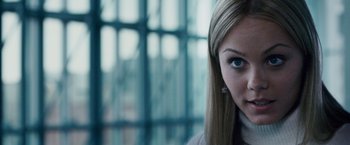 Movie still from “The Lookout” (2007), directed by Scott Frank – A woman's face in front of a window; Close Up shot, Over the shoulder angle