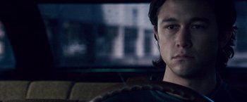 Movie still from “The Lookout” (2007), directed by Scott Frank – A young man sitting in the driver's seat of a car; Close Up shot, Over the shoulder angle