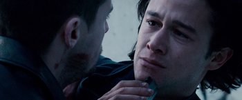 Movie still from “The Lookout” (2007), directed by Scott Frank – A man looking at another man's face with a knife; Close Up shot, Over the shoulder angle