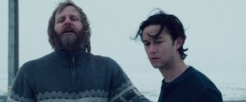 Movie still from “The Lookout” (2007), directed by Scott Frank – Two men standing next to each other on the beach; Medium shot, Low angle