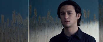 Movie still from “The Lookout” (2007), directed by Scott Frank – A young man standing in front of a field of wheat; Close Up shot, Low angle