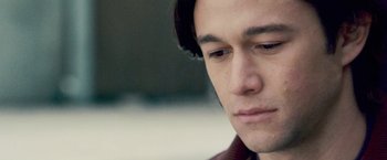 Movie still from “The Lookout” (2007), directed by Scott Frank – A man's face with a blurry background; Close Up shot, Over the shoulder angle