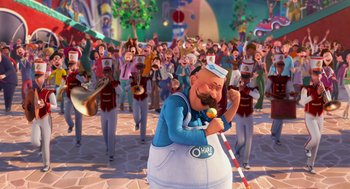 Movie still from “The Lorax” (2012), directed by Chris Renaud – A crowd of people are gathered around a man in a sailor suit; Extreme Wide shot, Over the shoulder angle
