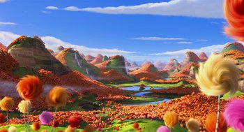 Movie still from “The Lorax” (2012), directed by Chris Renaud – An animated scene of a valley filled with flowers and mountains; Extreme Wide shot, High angle