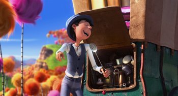 Movie still from “The Lorax” (2012), directed by Chris Renaud – An animated person is standing next to an open trunk; Medium shot, Low angle