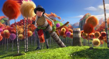 Movie still from “The Lorax” (2012), directed by Chris Renaud – A man is holding a log and a tree stump; Wide shot, Low angle