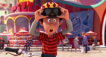 Movie still from “The Lorax” (2012), directed by Chris Renaud – A cartoon of a person wearing a bike helmet; Medium shot, Over the shoulder angle