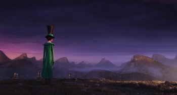 Movie still from “The Lorax” (2012), directed by Chris Renaud – A person wearing a top hat standing on a hill; Extreme Wide shot, Low angle