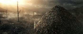 Movie still from “The Lord of the Rings: The Rings of Power” (2022), created by Patrick McKay – A large pile of garlic in the middle of a field; Extreme Wide shot, High angle
