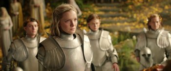 Movie still from “The Lord of the Rings: The Rings of Power” (2022), created by Patrick McKay – Two women dressed in metal armor standing next to each other; Medium shot, Over the shoulder angle
