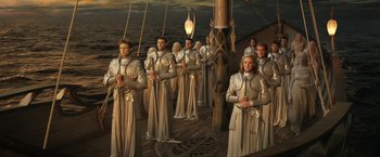 Movie still from “The Lord of the Rings: The Rings of Power” (2022), created by Patrick McKay – A group of people standing on top of a boat; Wide shot, High angle