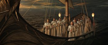 Movie still from “The Lord of the Rings: The Rings of Power” (2022), created by Patrick McKay – A group of men standing on top of a boat in the ocean; Wide shot, High angle