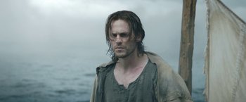 Movie still from “The Lord of the Rings: The Rings of Power” (2022), created by Patrick McKay – A person with wet hair; Close Up shot, Low angle