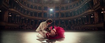 Movie still from “Red Sparrow” (2018), directed by Francis Lawrence – A man and a woman are performing on a stage; Wide shot, Low angle