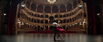 Movie still from “Red Sparrow” (2018), directed by Francis Lawrence – A man and a woman dancing in a theater; Wide shot, Low angle