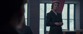 Movie still from “Red Sparrow” (2018), directed by Francis Lawrence – A woman standing in front of a mirror in front of a window; Medium shot, Over the shoulder angle