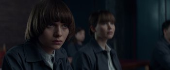 Movie still from “Red Sparrow” (2018), directed by Francis Lawrence – A group of people that are standing in a room; Close Up shot, Over the shoulder angle