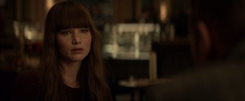 Movie still from “Red Sparrow” (2018), directed by Francis Lawrence – A person with long brown hair; Close Up shot, Over the shoulder angle