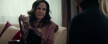 Movie still from “Red Sparrow” (2018), directed by Francis Lawrence – A woman sitting in a chair with a teddy bear in front of her; Close Up shot, Over the shoulder angle