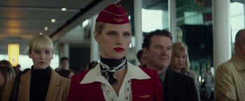 Movie still from “Red Sparrow” (2018), directed by Francis Lawrence – A woman in a flight attendant's uniform; Close Up shot, Low angle