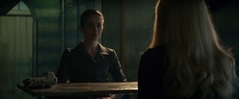 Movie still from “Red Sparrow” (2018), directed by Francis Lawrence – A woman sitting in front of a mirror in front of a window; Medium shot, Over the shoulder angle