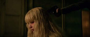 Movie still from “Red Sparrow” (2018), directed by Francis Lawrence – A woman getting her hair blow dried by a hairstylist; Close Up shot, Over the shoulder angle