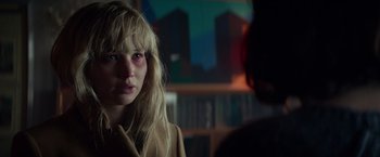 Movie still from “Red Sparrow” (2018), directed by Francis Lawrence – A woman with blonde hair and blue eyes stares at the camera; Close Up shot, Over the shoulder angle